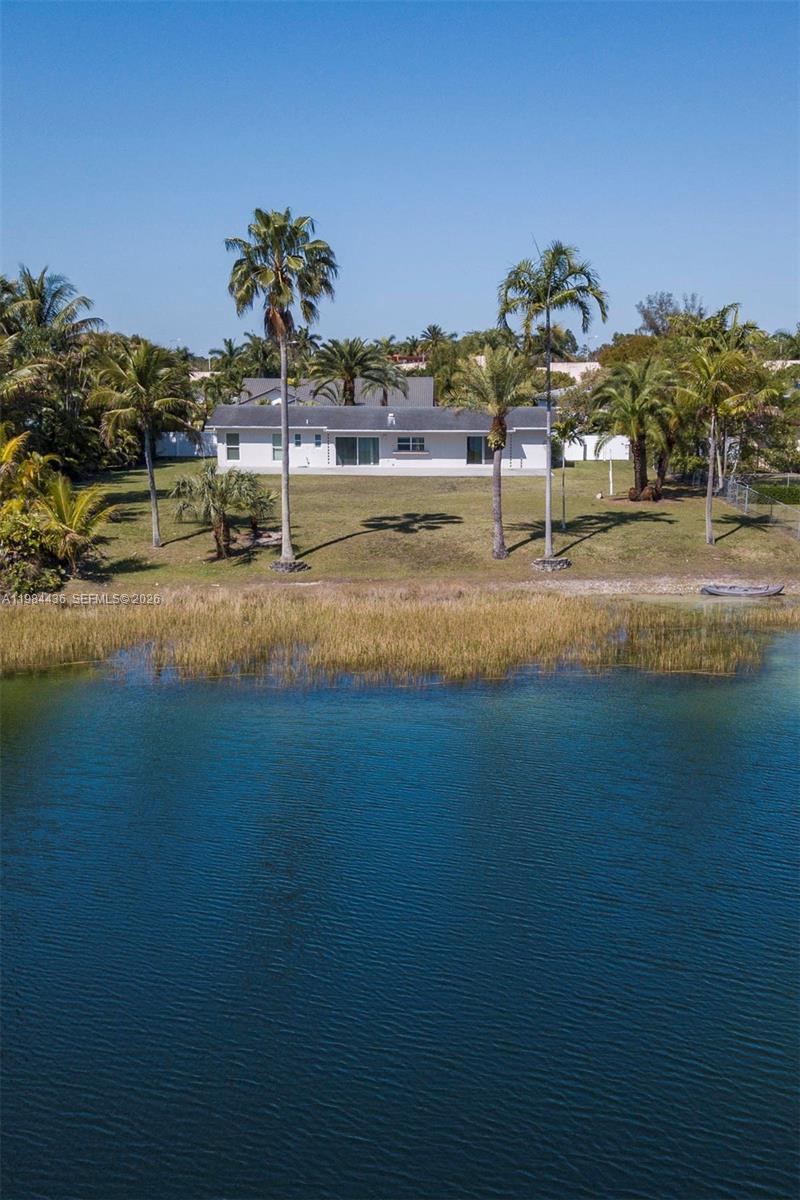 11807 Southwest 112th Avenue Miami, FL 33176 - Photo 44 of 48 a view of a house with a yard