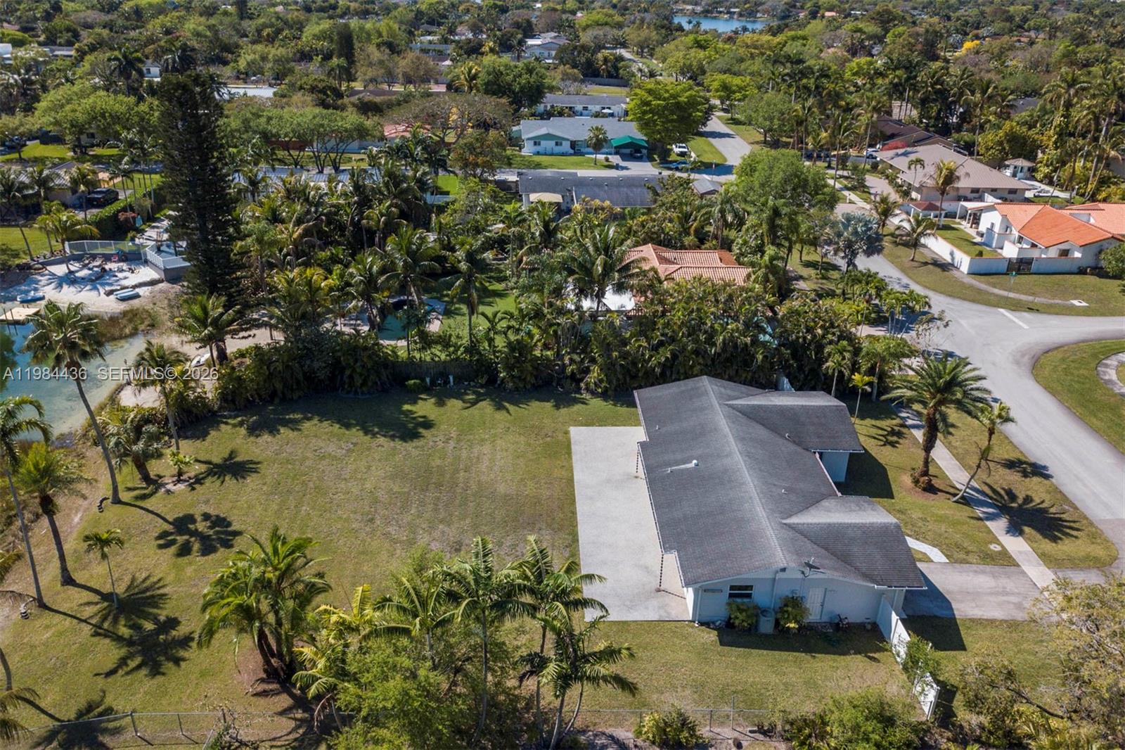 11807 Southwest 112th Avenue Miami, FL 33176 - Photo 47 of 48 an aerial view of a house with outdoor space and lake view