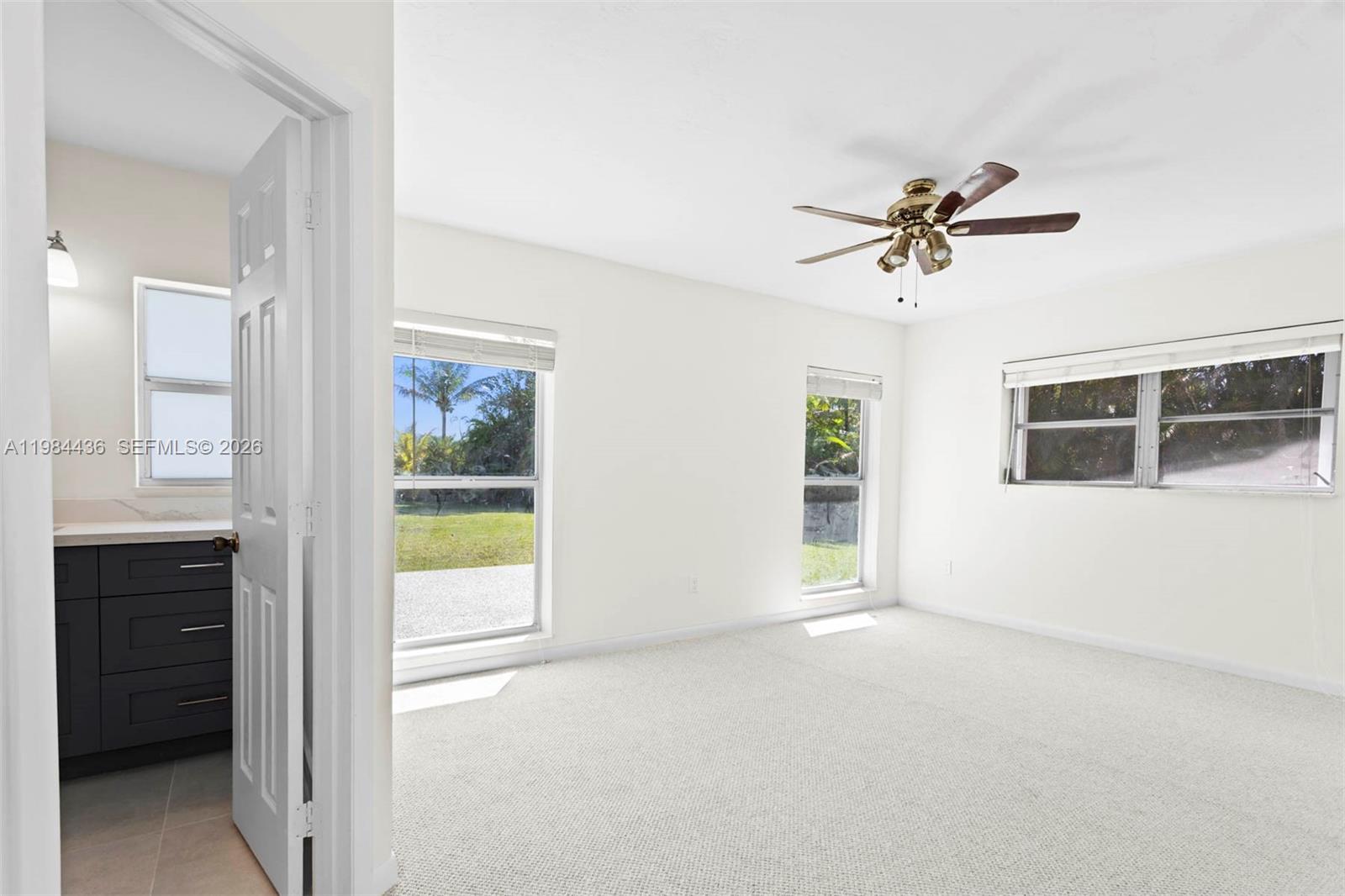 11807 Southwest 112th Avenue Miami, FL 33176 - Photo 6 of 48 a view of an empty room with a window
