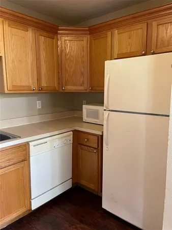 a white refrigerator freezer sitting in a kitchen