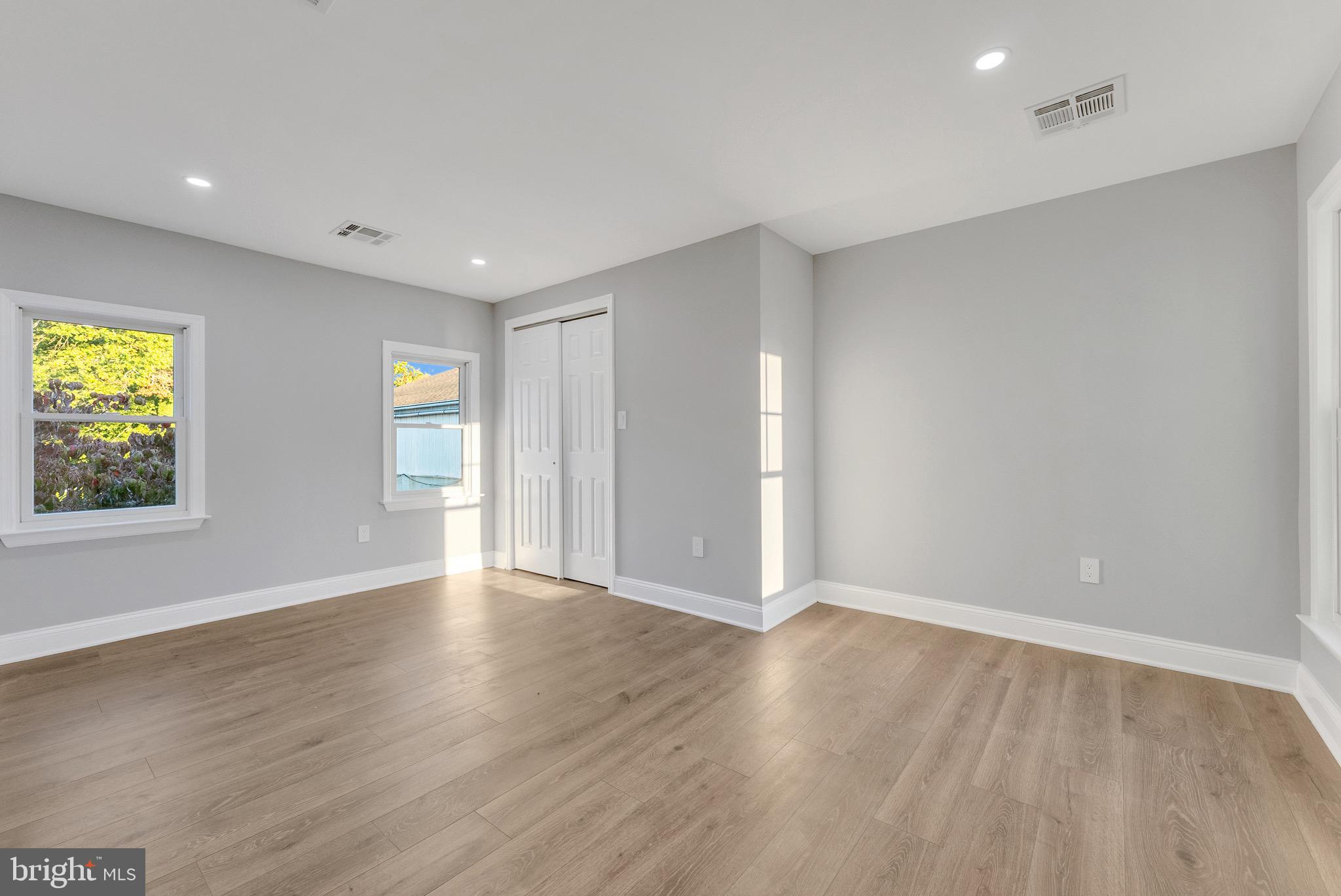 15 North Main Street, Unit B Pennington, NJ 08534 - Photo 12 of 15 a view of an empty room with wooden floor and a window