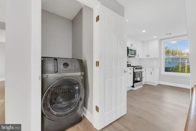 a view of a kitchen with washer and dryer
