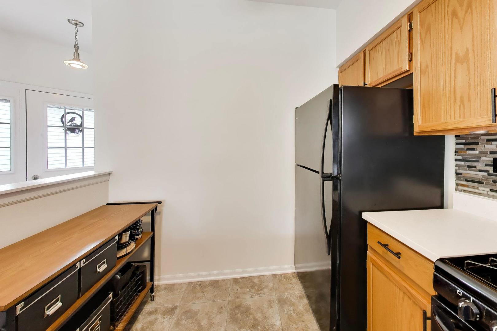 17804 Braewick Road Gurnee, IL 60031 - Photo 11 of 27 a kitchen with stainless steel appliances a refrigerator and a stove