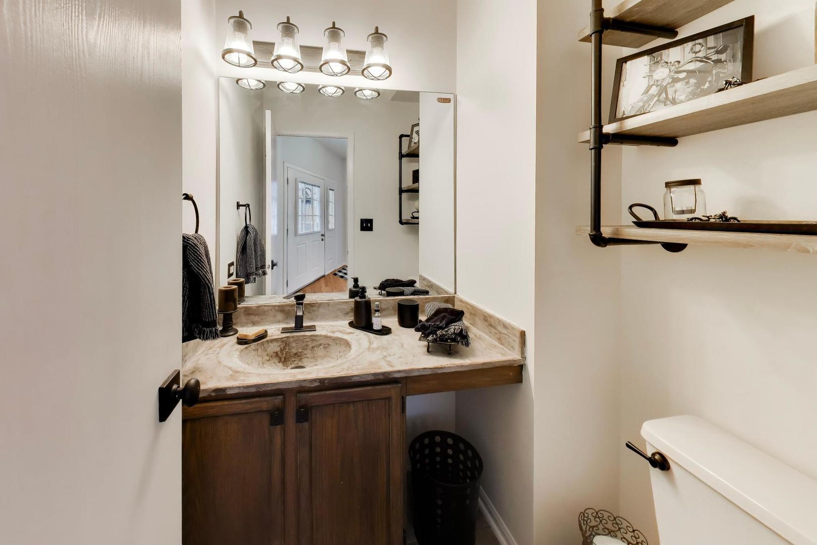 17804 Braewick Road Gurnee, IL 60031 - Photo 13 of 27 a bathroom with a sink vanity and a mirror
