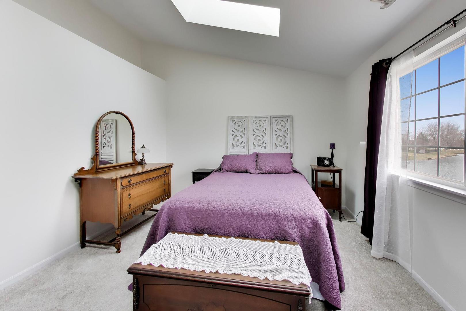 17804 Braewick Road Gurnee, IL 60031 - Photo 16 of 27 a bedroom with a bed and window