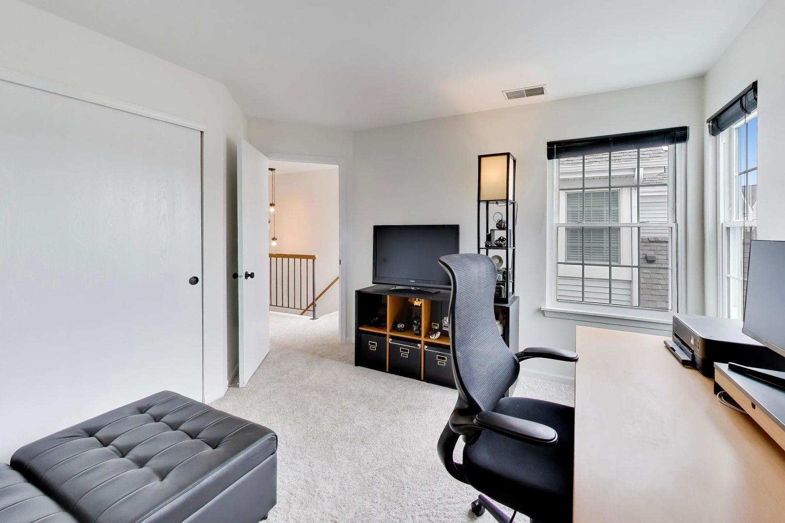 17804 Braewick Road Gurnee, IL 60031 - Photo 20 of 27 a living room with furniture and a flat screen tv