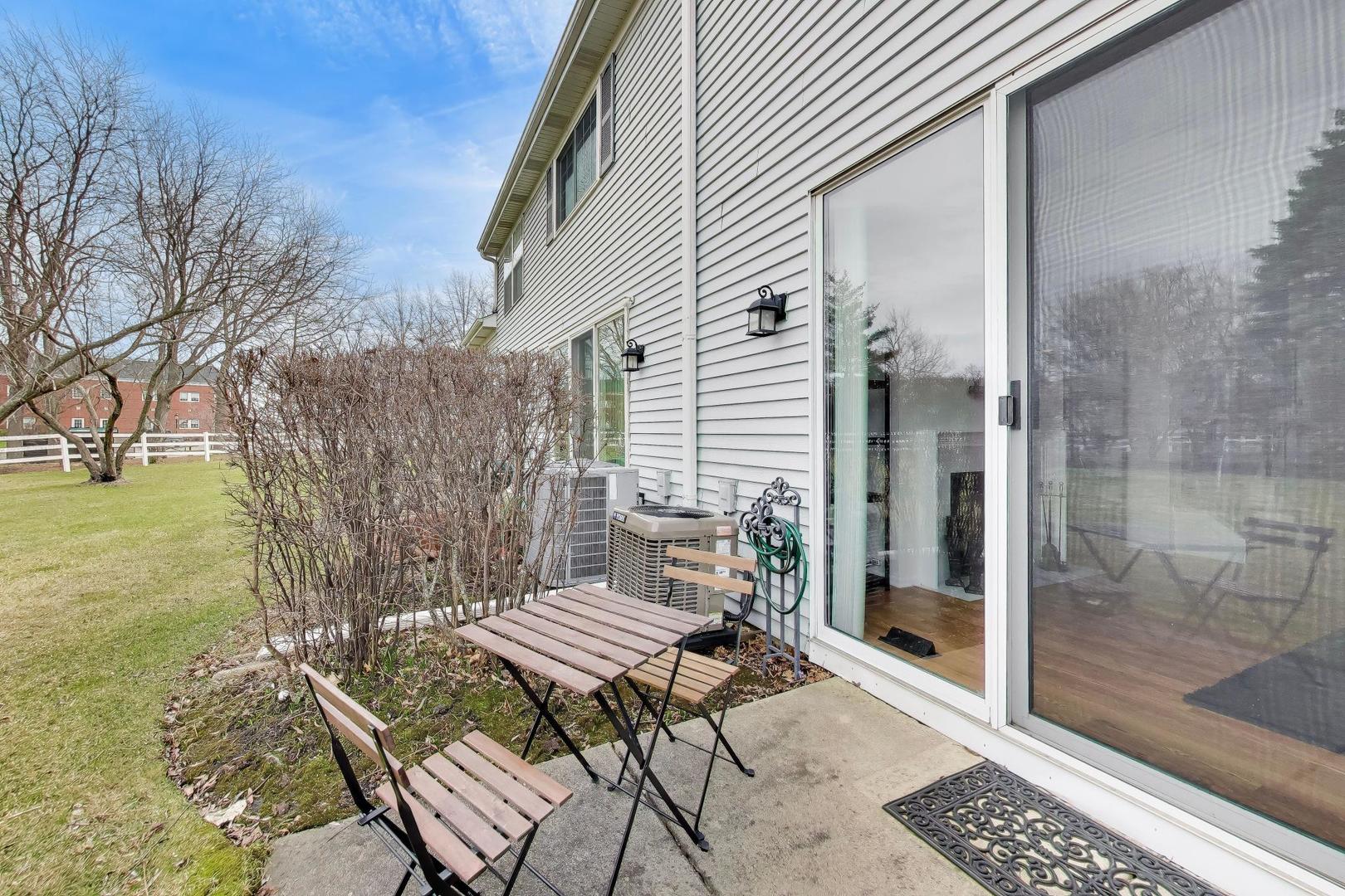 17804 Braewick Road Gurnee, IL 60031 - Photo 25 of 27 a view of a patio with a table chairs and backyard