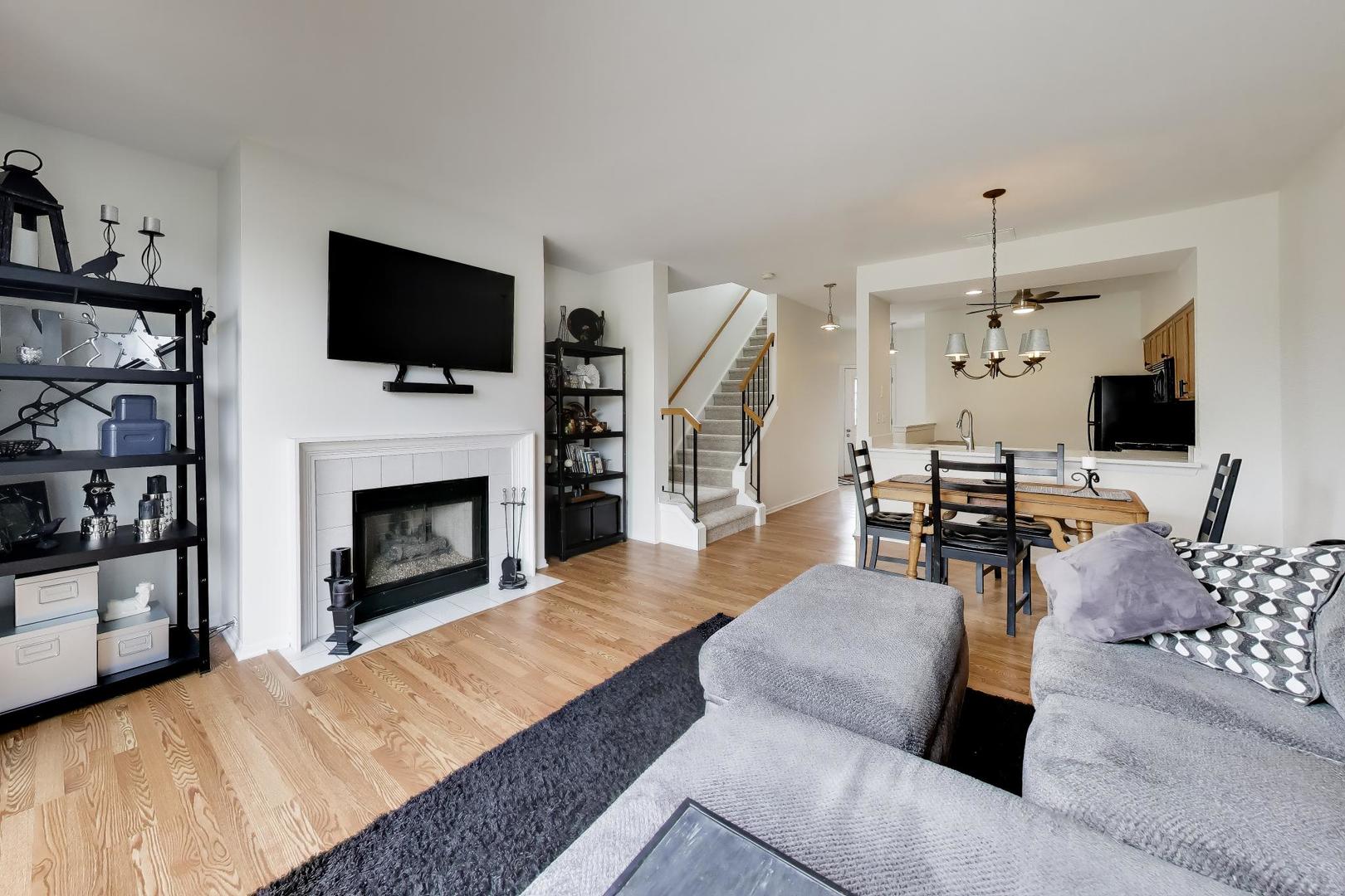 17804 Braewick Road Gurnee, IL 60031 - Photo 6 of 27 a living room with furniture fireplace and flat screen tv
