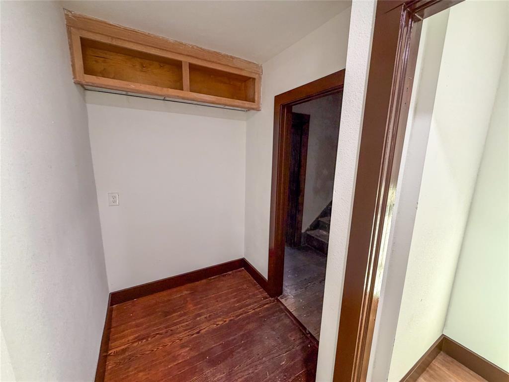 107 East Stone Street, Unit B Collinsville, TX 76233 - Photo 15 of 16 a view of a hallway with wooden floor and a hallway