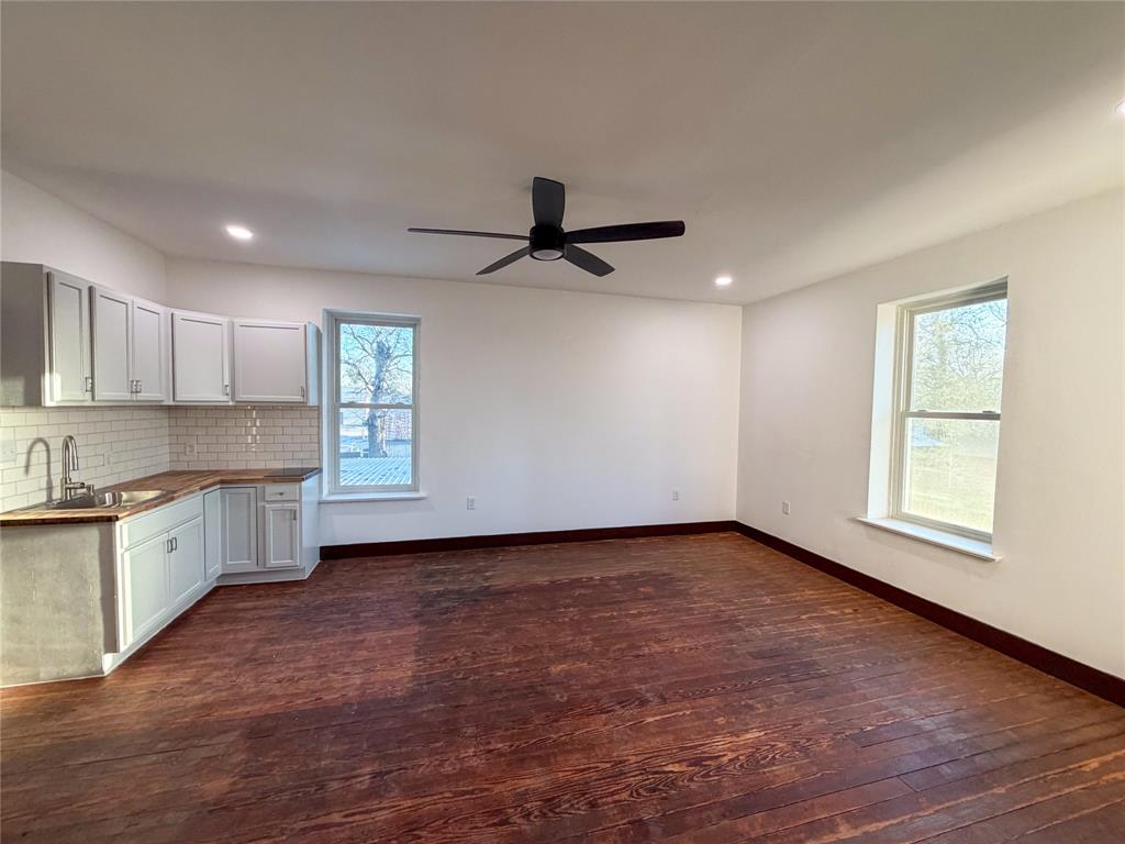 107 East Stone Street, Unit B Collinsville, TX 76233 - Photo 2 of 16 a view of a kitchen with a sink and a window