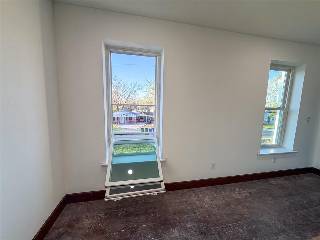 107 East Stone Street, Unit B Collinsville, TX 76233 - Photo 8 of 16 an empty room with window