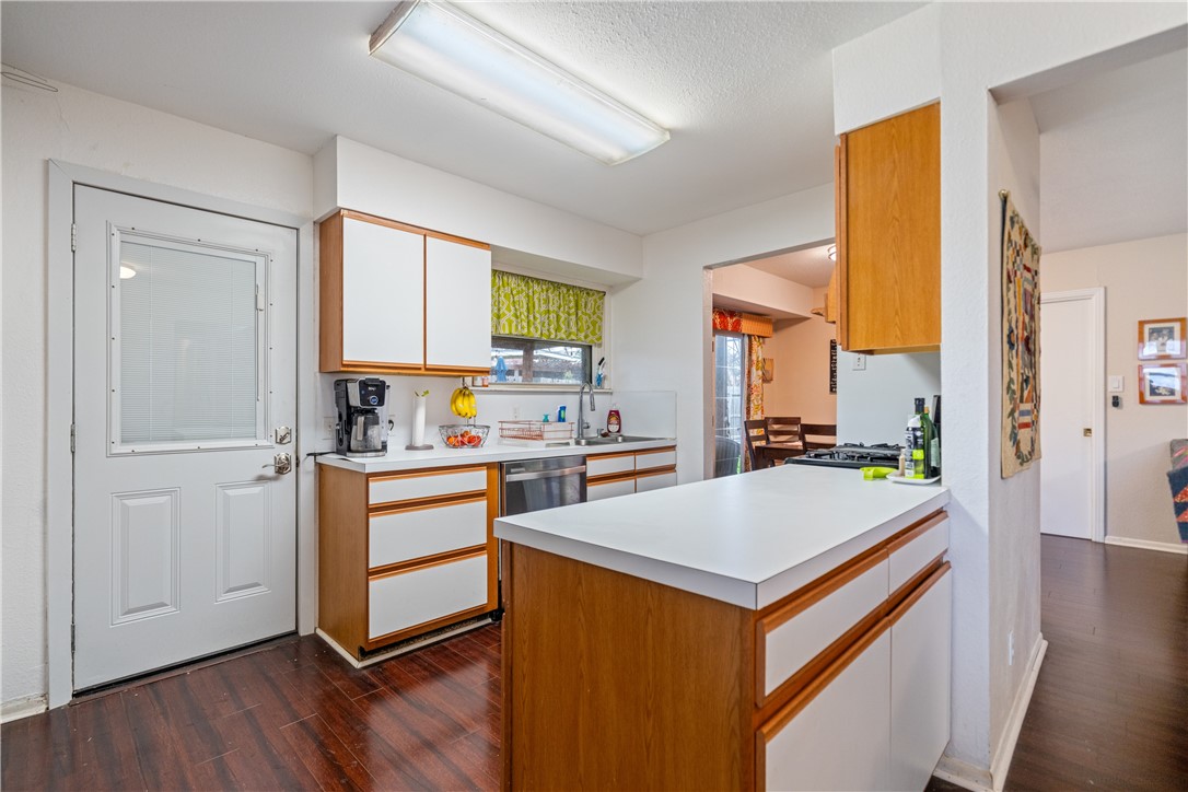 4338 Yucca Street Corpus Christi, TX 78411 - Photo 11 of 31 a kitchen with a refrigerator and a stove