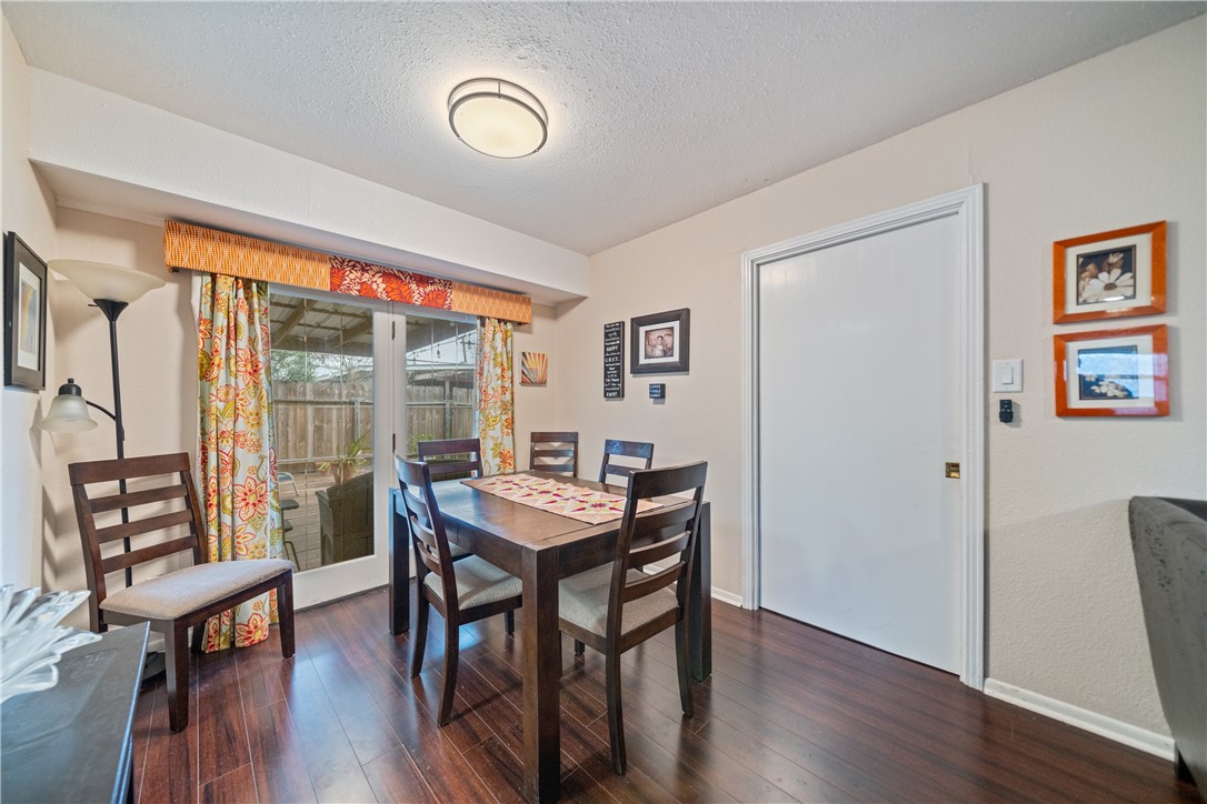 4338 Yucca Street Corpus Christi, TX 78411 - Photo 14 of 31 a view of a dining room with furniture wooden floor and next to a window