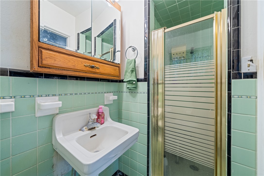 4338 Yucca Street Corpus Christi, TX 78411 - Photo 22 of 31 a bathroom with a sink and a mirror