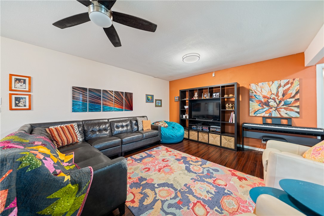 4338 Yucca Street Corpus Christi, TX 78411 - Photo 6 of 31 a living room with furniture and a flat screen tv