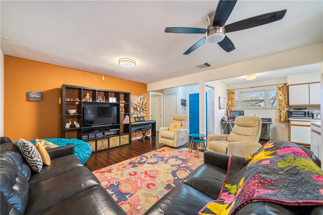 4338 Yucca Street Corpus Christi, TX 78411 - Photo 7 of 31 a living room with furniture and a flat screen tv