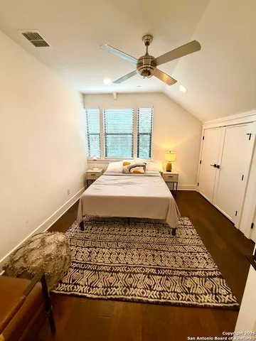 a large white bed in a white room