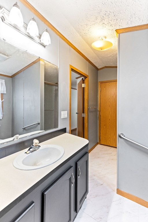 51 Tucker Terrace Raynham, MA 02767 - Photo 27 of 35 a bathroom with a sink and a mirror