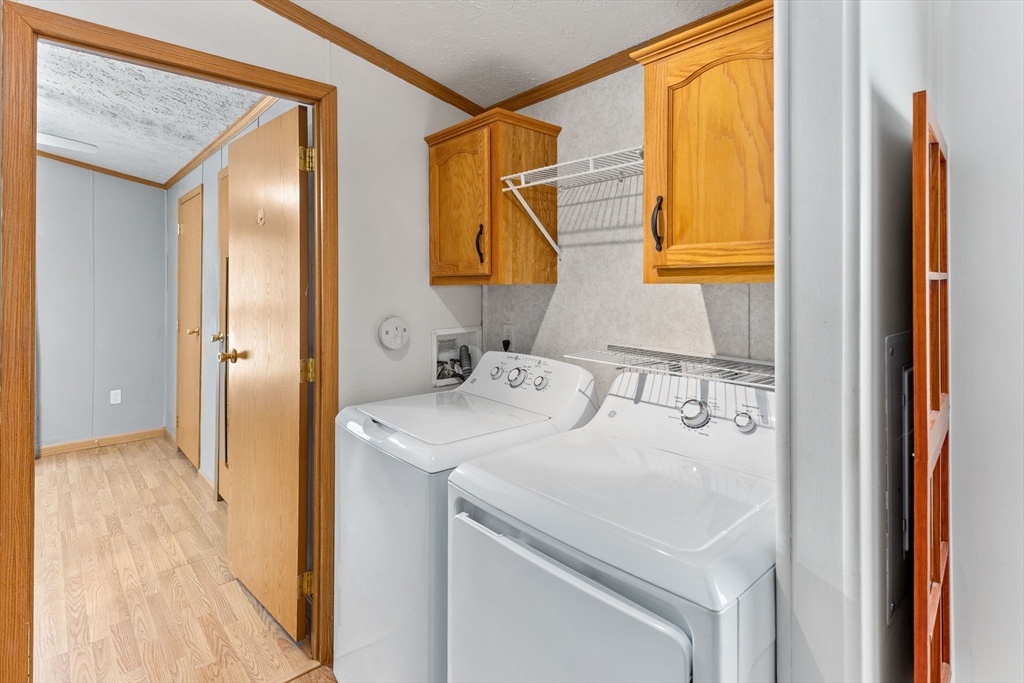51 Tucker Terrace Raynham, MA 02767 - Photo 29 of 35 a en suite bathroom with a sink and a mirror