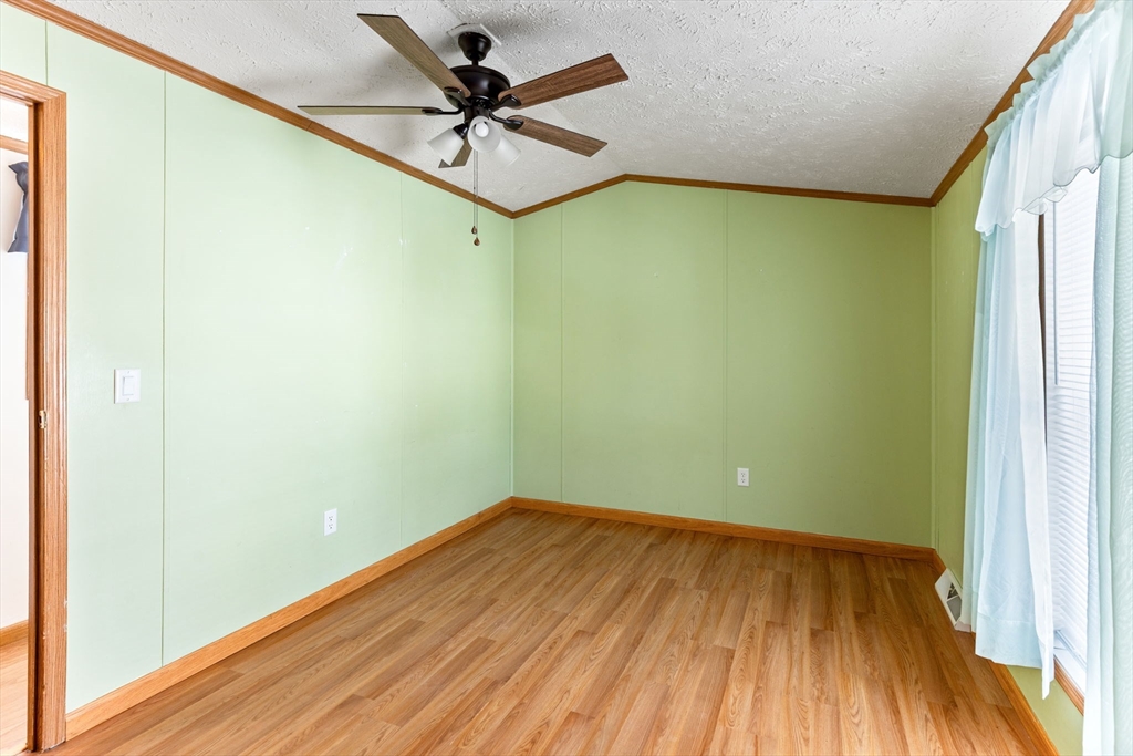 51 Tucker Terrace Raynham, MA 02767 - Photo 31 of 35 a view of a big room with wooden floor and a chandelier fan