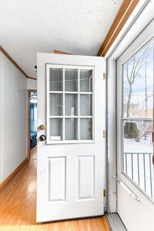 51 Tucker Terrace Raynham, MA 02767 - Photo 32 of 35 a view of an empty room with wooden floor and a window