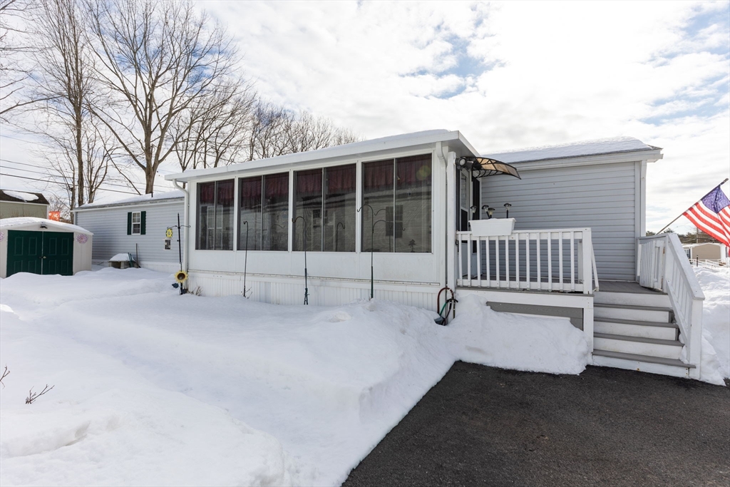 51 Tucker Terrace Raynham, MA 02767 - Photo 7 of 35 a view of a house with a wooden fence