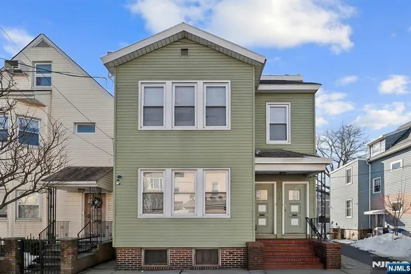 a front view of a house with parking