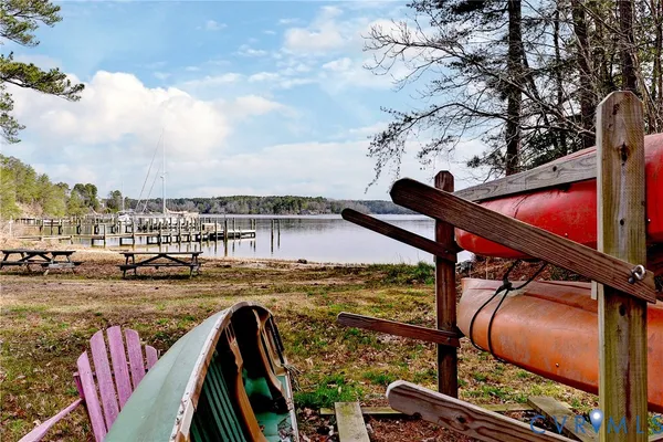 a view of a lake with houses in the back