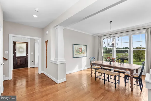 a living room with furniture and large windows