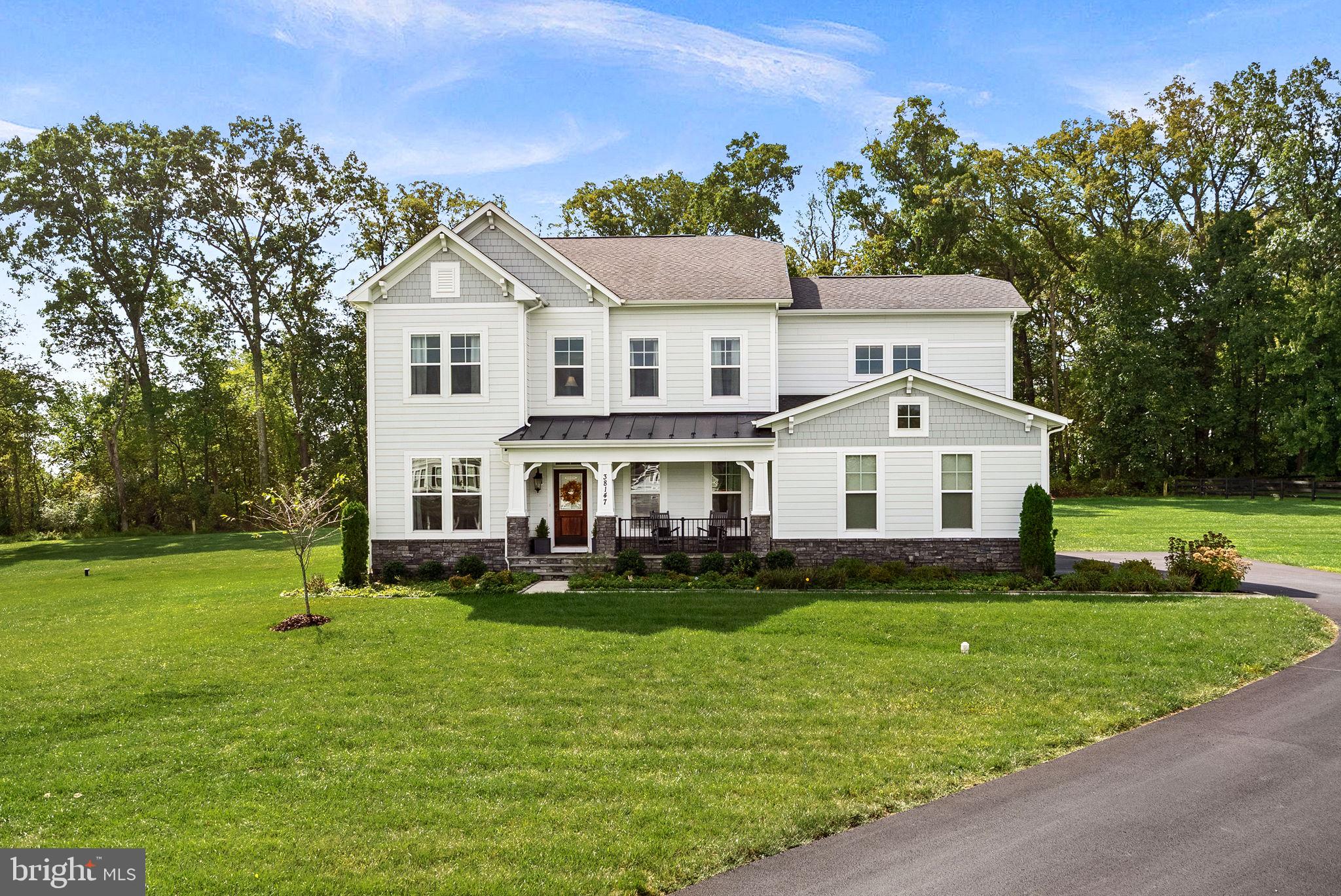 38147 Touchstone Farm Lane Hamilton, VA 20158 - Photo 2 of 71 a front view of a house with garden