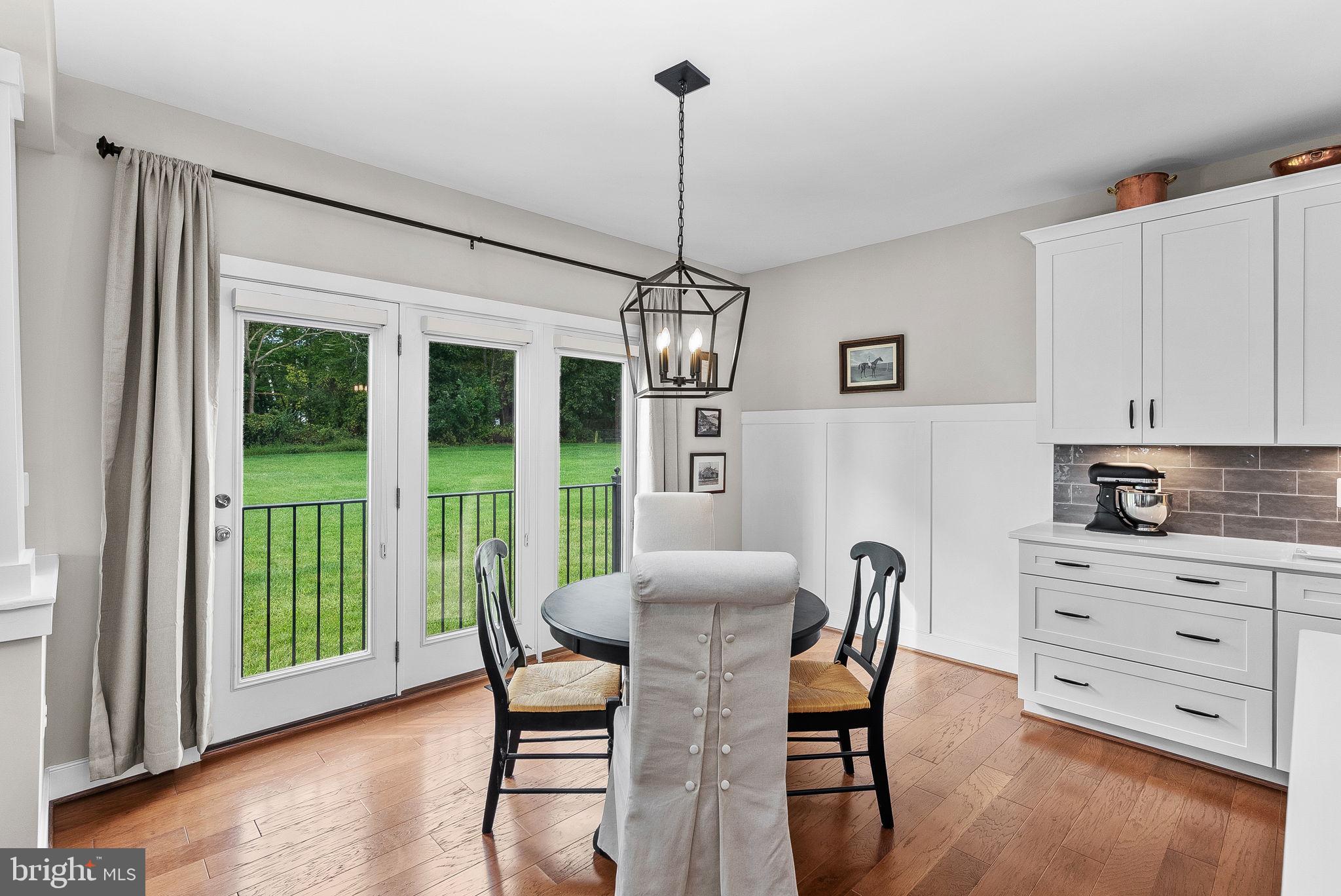 38147 Touchstone Farm Lane Hamilton, VA 20158 - Photo 25 of 71 a dining room with furniture a chandelier and wooden floor
