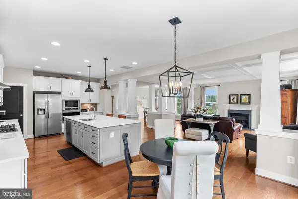 a view of a hallway with wooden floor and closet