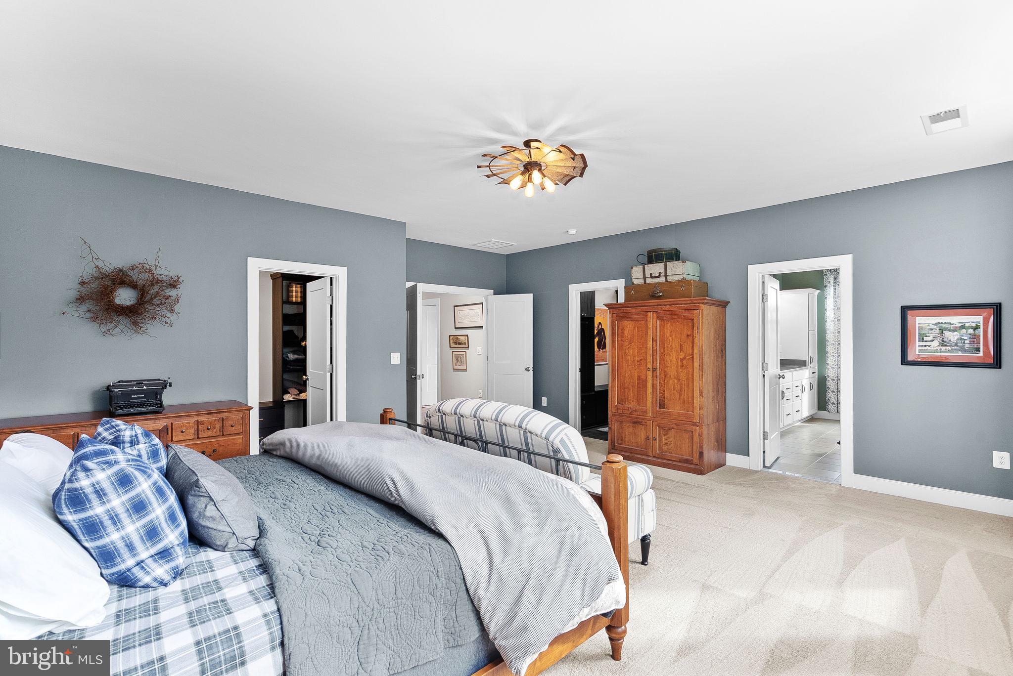 38147 Touchstone Farm Lane Hamilton, VA 20158 - Photo 37 of 71 a bedroom with a bed and a couch