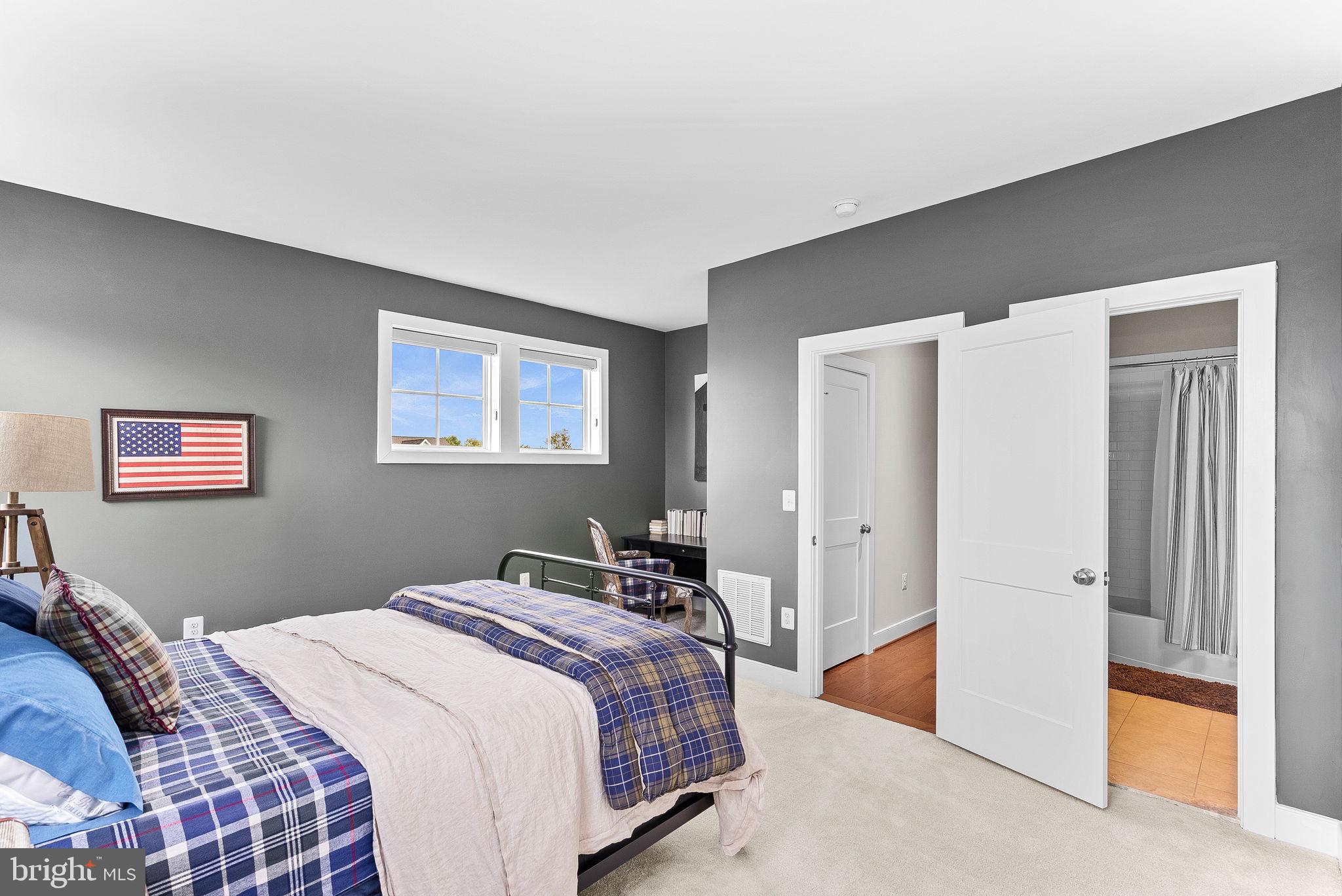 38147 Touchstone Farm Lane Hamilton, VA 20158 - Photo 54 of 71 a bedroom with a large bed and a window