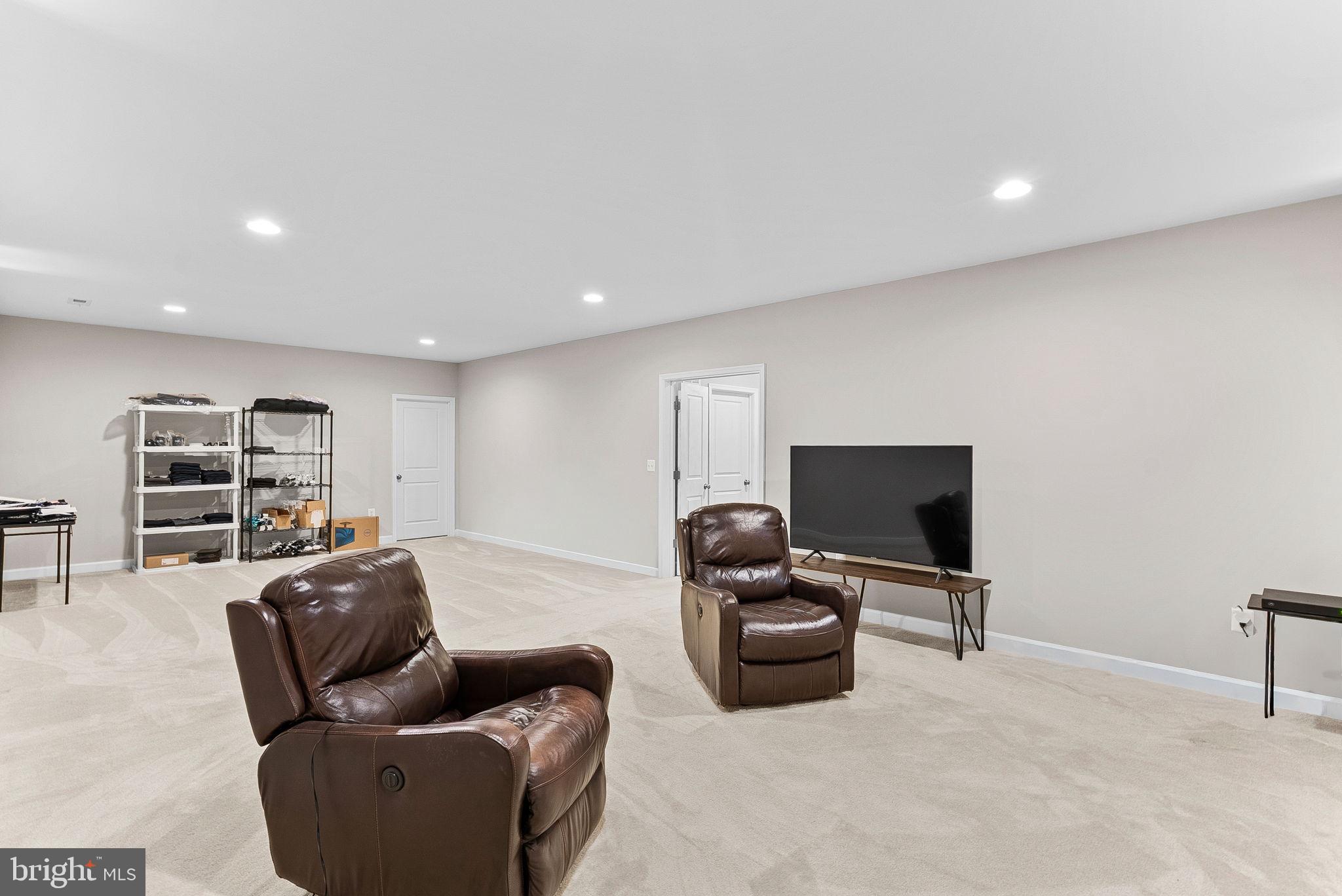 38147 Touchstone Farm Lane Hamilton, VA 20158 - Photo 60 of 71 a living room with furniture and a flat screen tv