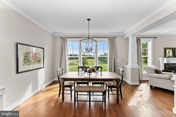 a dining room with furniture window wooden floor