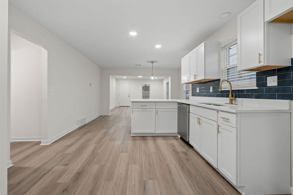 2859 Carnes Avenue Memphis, TN 38114 - Photo 6 of 14 a kitchen with white cabinets stainless steel appliances