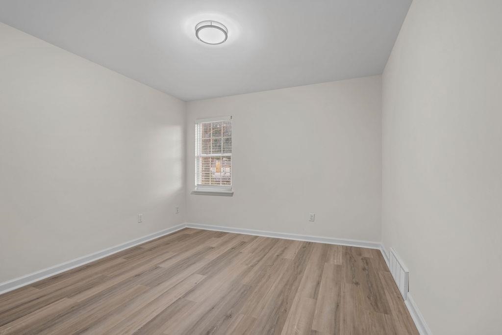 2859 Carnes Avenue Memphis, TN 38114 - Photo 8 of 14 an empty room with a hardwood and a window