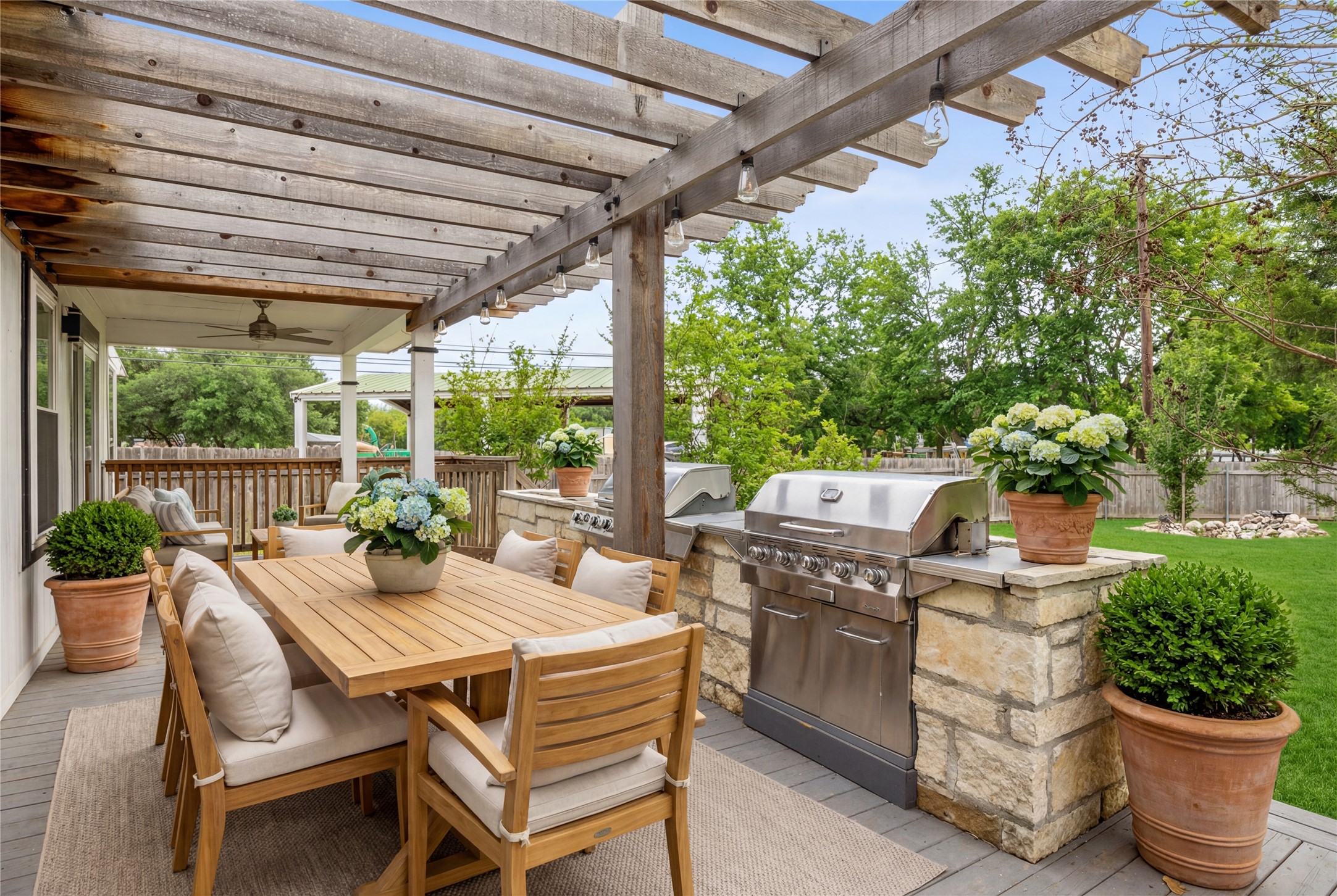 14409 Sandifer Street Austin, TX 78725 - Photo 27 of 31 Virtually Enhanced. View of patio / terrace with an outdoor kitchen / dining area, ceiling fan, and a pergola