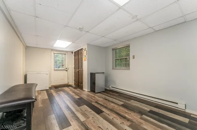 a view of a livingroom with wooden floor