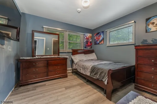 a bedroom with a bed and a dresser