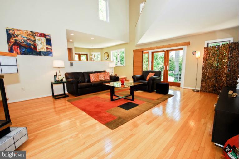 11576 Lake Newport Road Reston, VA 20194 - Photo 12 of 30 a living room with furniture and a flat screen tv