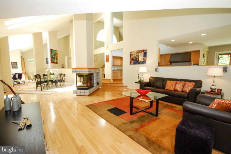 11576 Lake Newport Road Reston, VA 20194 - Photo 15 of 30 a living room with furniture and a fireplace