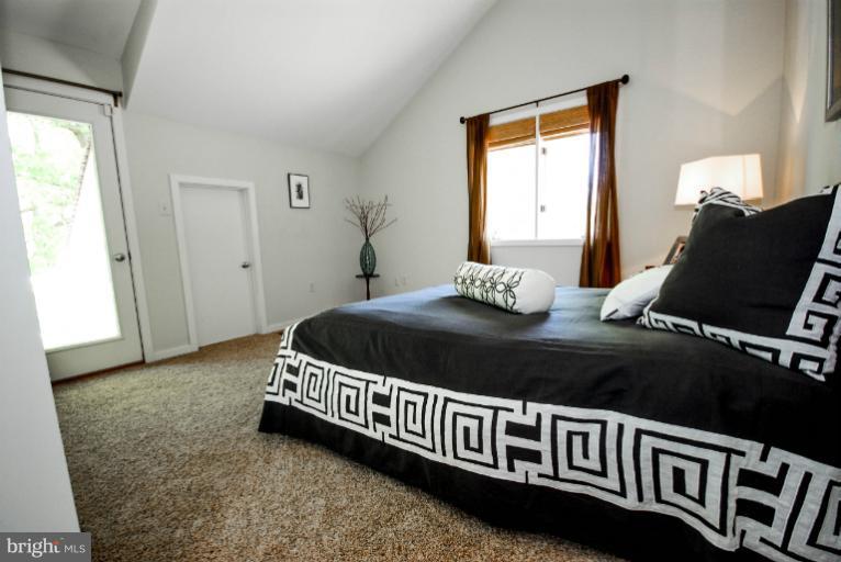11576 Lake Newport Road Reston, VA 20194 - Photo 20 of 30 a bedroom with a bed and window