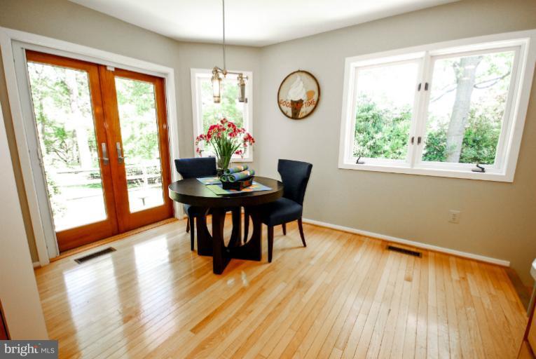 11576 Lake Newport Road Reston, VA 20194 - Photo 6 of 30 a view of a dining room with furniture window and wooden floor