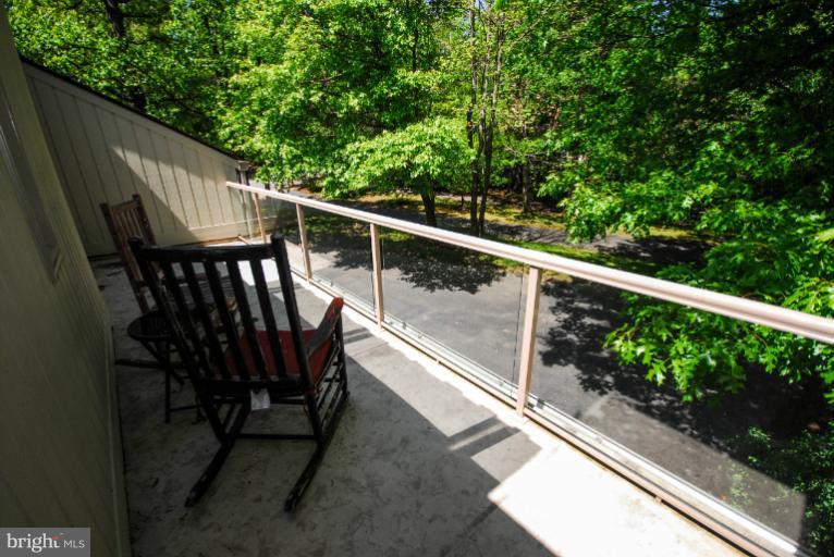 11576 Lake Newport Road Reston, VA 20194 - Photo 7 of 30 a view of balcony with wooden floor and fence