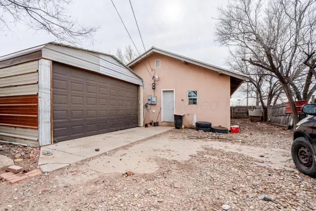 a view of a house with a snow on the road