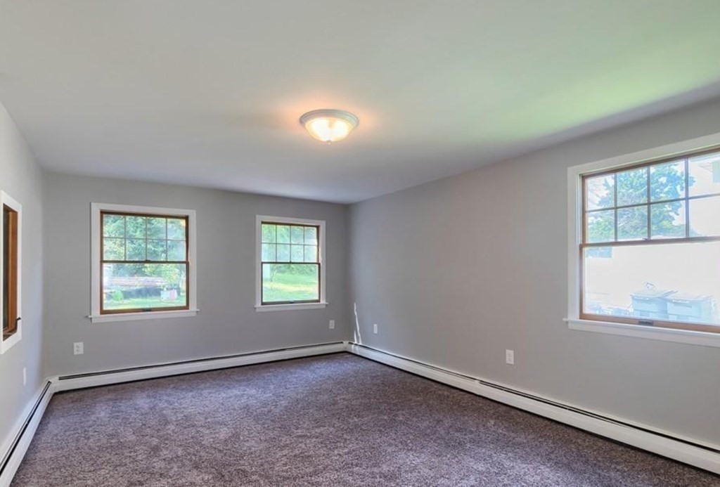 142 East Meadow Road Lowell, MA 01854 - Photo 6 of 28 an empty room with windows