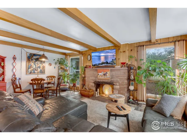 a bedroom with a bed and a large mirror