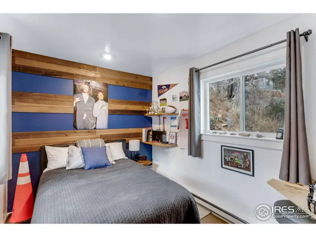 a bathroom with a granite countertop sink toilet a mirror and shower
